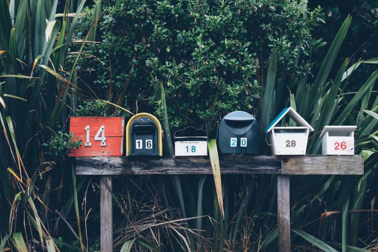 Mailboxes. Photo by Mathyas Kurmann, Unsplash